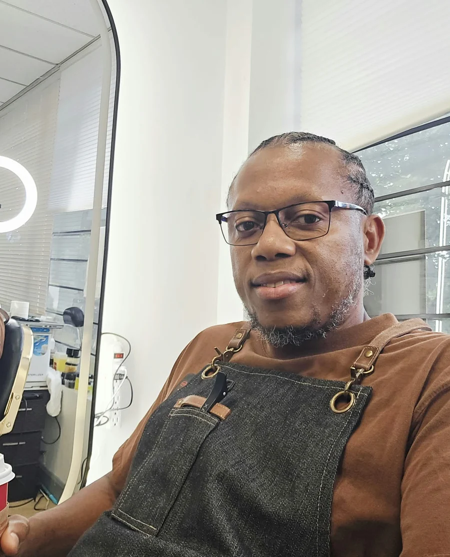 Delon, barber and owner of Delon The Barber in Scarborough, Ontario